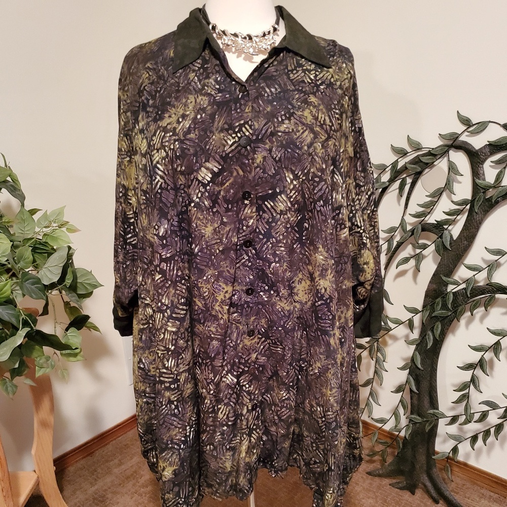 Shades of green, white and black adorn this blouse